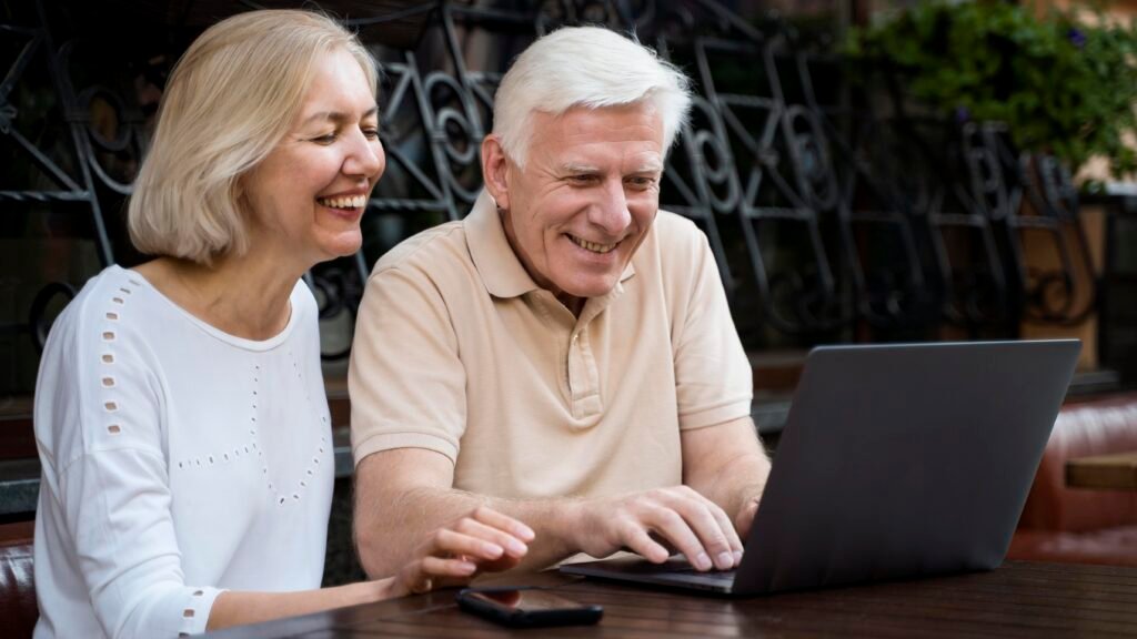 senior couple with laptop